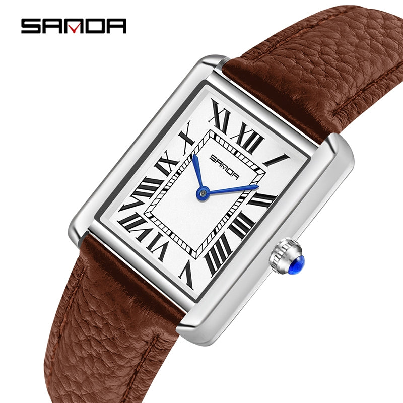 Watch with brown leather strap and silver case on a white background