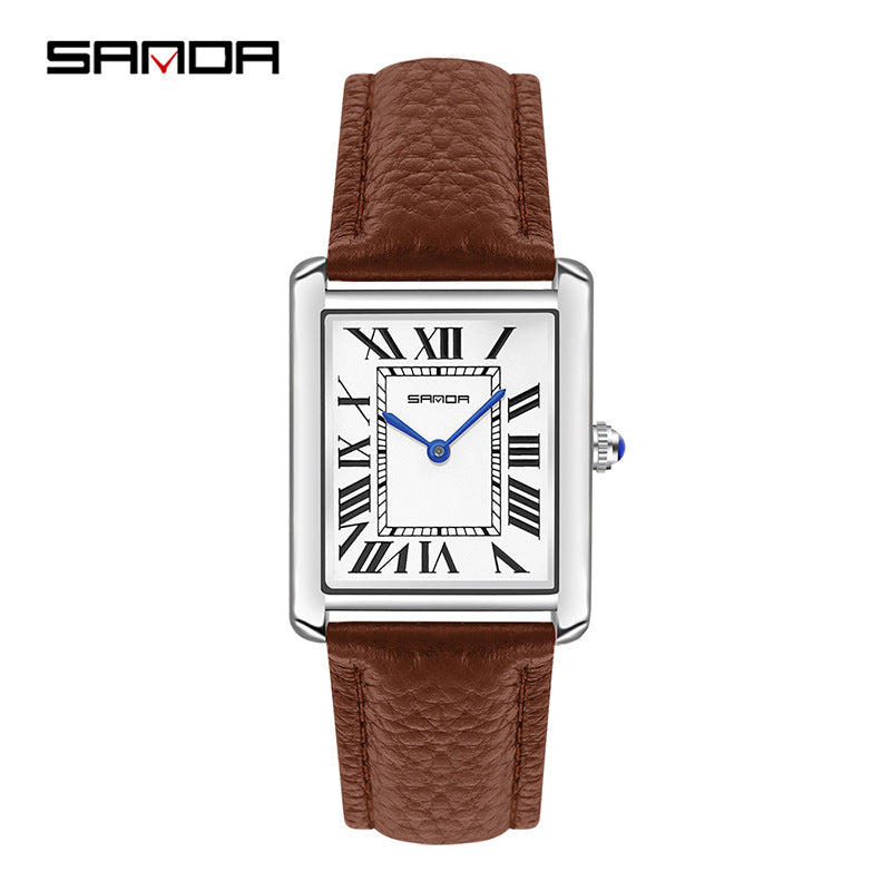 Watch with brown leather strap and white face displaying Roman numerals on a white background. Sanda 1108 brown leather belt.