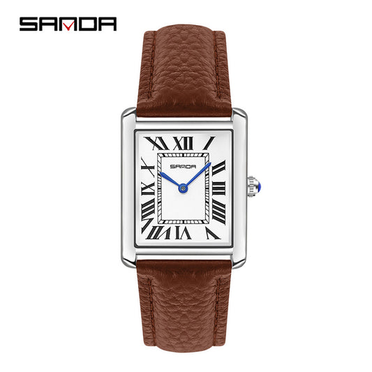 Watch with brown leather strap and white face displaying Roman numerals on a white background. Sanda 1108 brown leather belt.
